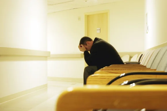 Man in hospital waiting alone